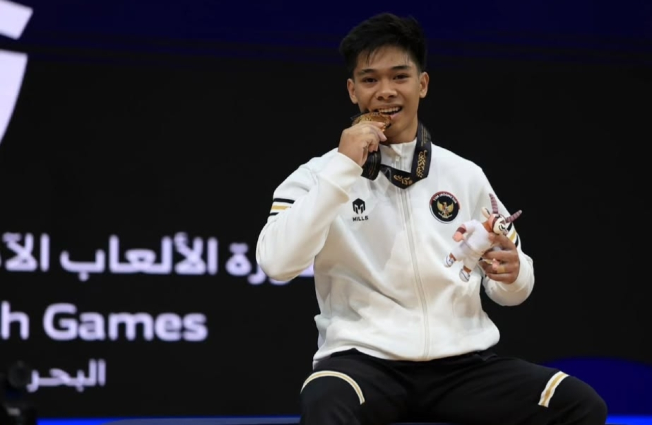 Asian Youth Games 2025: Lifter Indonesia Rijal Abdillah Raih Medali Emas Angkat Besi